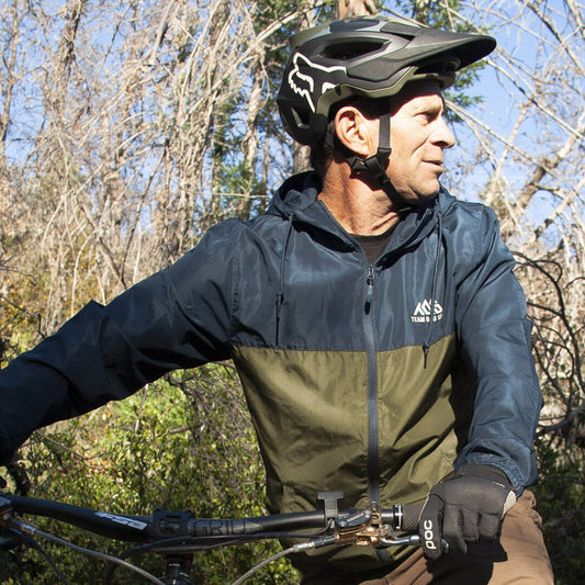 Nylon windbreaker navy and green on bike rider